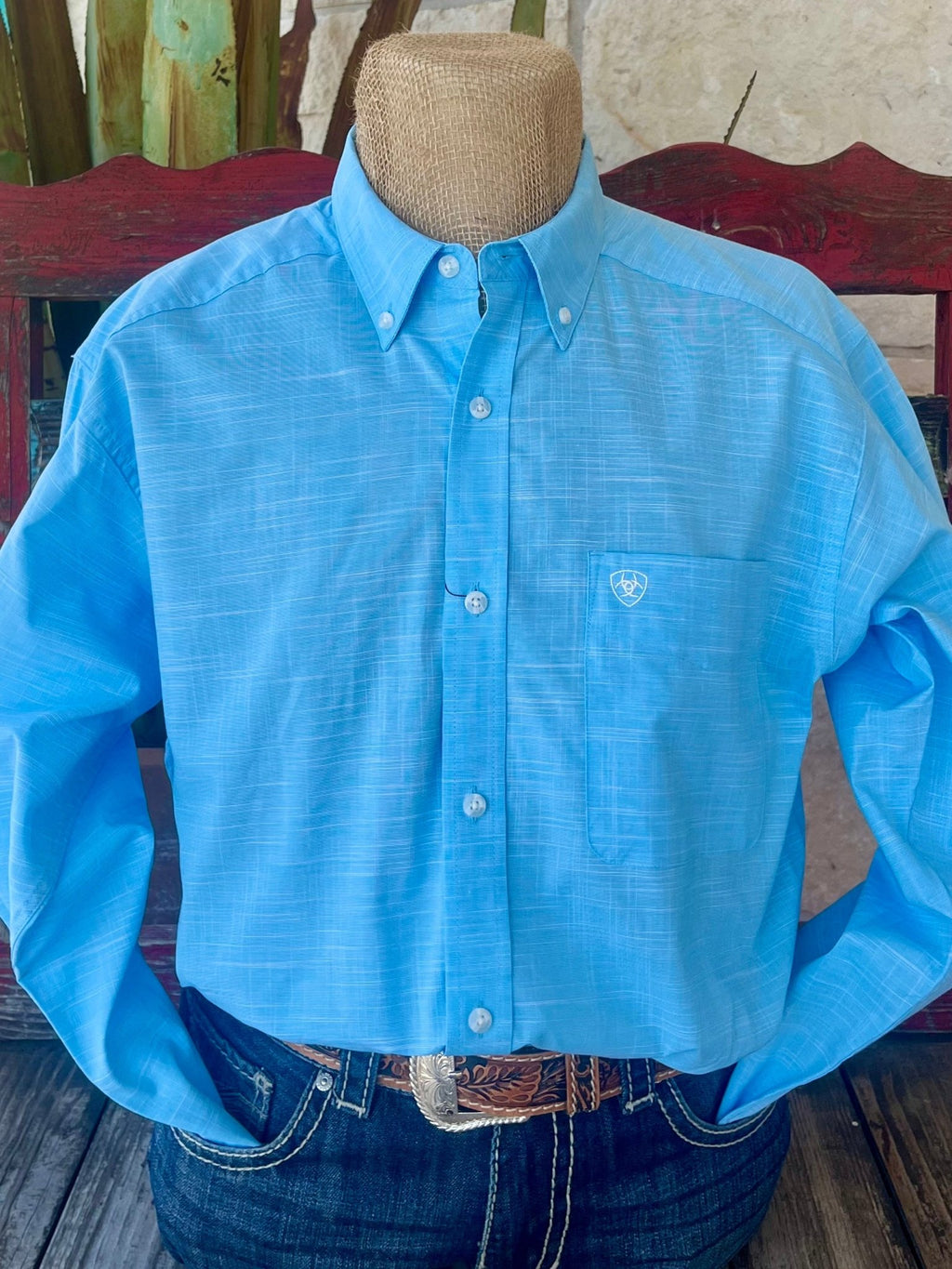 Men’s Ariat Long Sleeve Button Down Shirt in light blue, lightweight breathable fabric with stylish slub texture and embroidered logo on chest pocket - 10058785. Available at Blair's Western Wear, Marble Falls, TX.