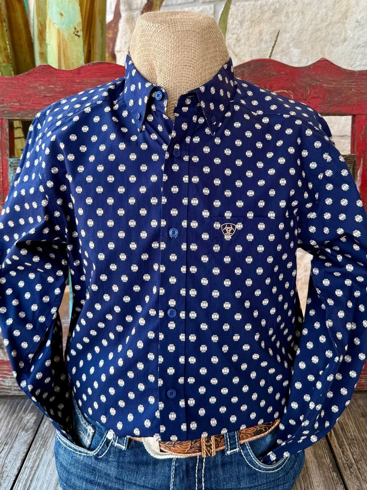Men’s Ariat button-down Aztec print shirt in navy and tan, made from breathable cotton, with an embroidered logo chest pocket – 10062246. Available at Blair's Western Wear, Marble Falls, TX.