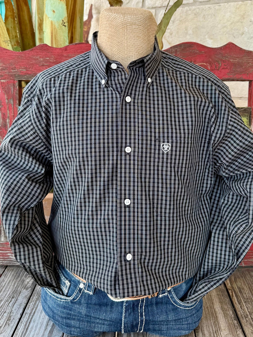 Men’s Ariat Western Shirt in black and white check, made from breathable cotton for all-day comfort, with button-down collar and Ariat logo chest pocket – 10065782. Available at Blair’s Western Wear, Marble Falls, TX.