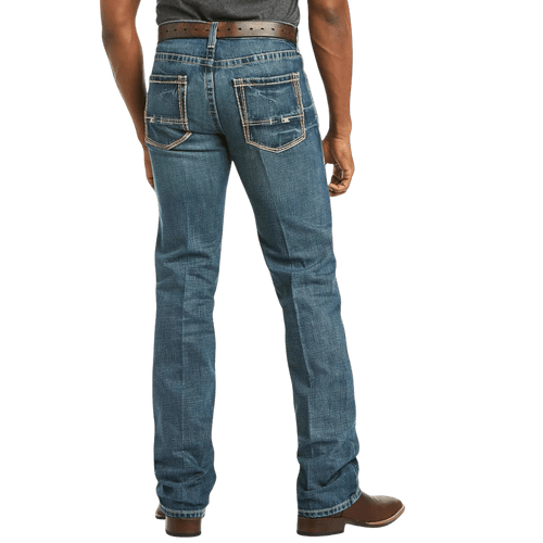 Men's slim fit straight leg jean in medium wash 13 oz. cotton denim with hand-sanding, whiskering, and embroidered back pockets — Blair's Western Wear Marble Falls TX