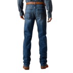 Men's dark blue slim straight jeans with faded seat, angular contrasting back-pocket stitching and full-length legs — Blair's Western Wear Marble Falls TX