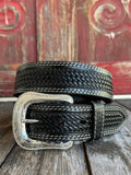 Black leather with full basketweave tooling, scalloped edge detail, and white contrast stitching — finished with a large engraved silver western buckle. A clean, classic western belt with sharp contrast and serious handcrafted character.