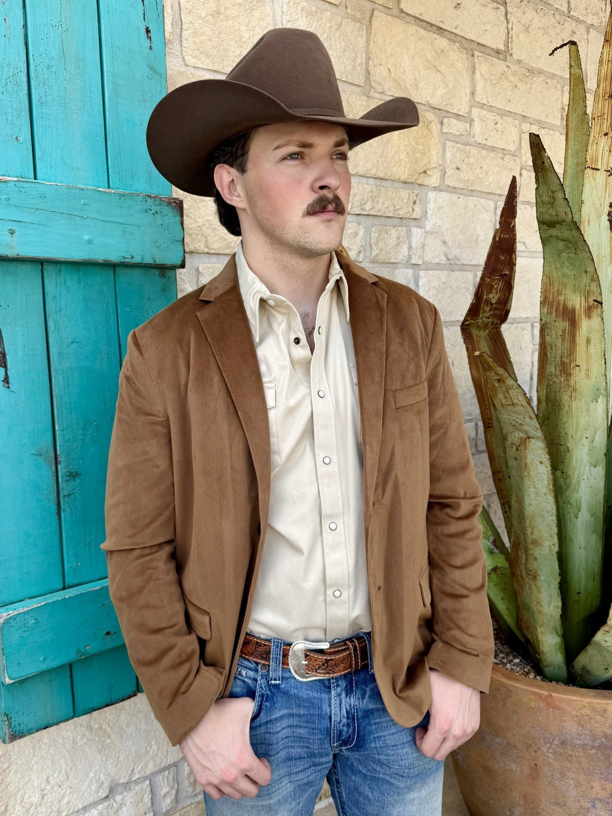 Men's brown corduroy sport coat with fine vertical ribs, notch lapels, welt chest pocket, lower flap pockets, and long sleeves — Blair's Western Wear Marble Falls TX