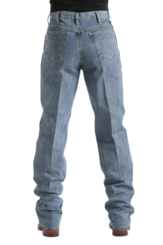 Rear view of a person wearing light blue straight-leg denim jeans with a black top and brown shoes, shown against a plain white background.