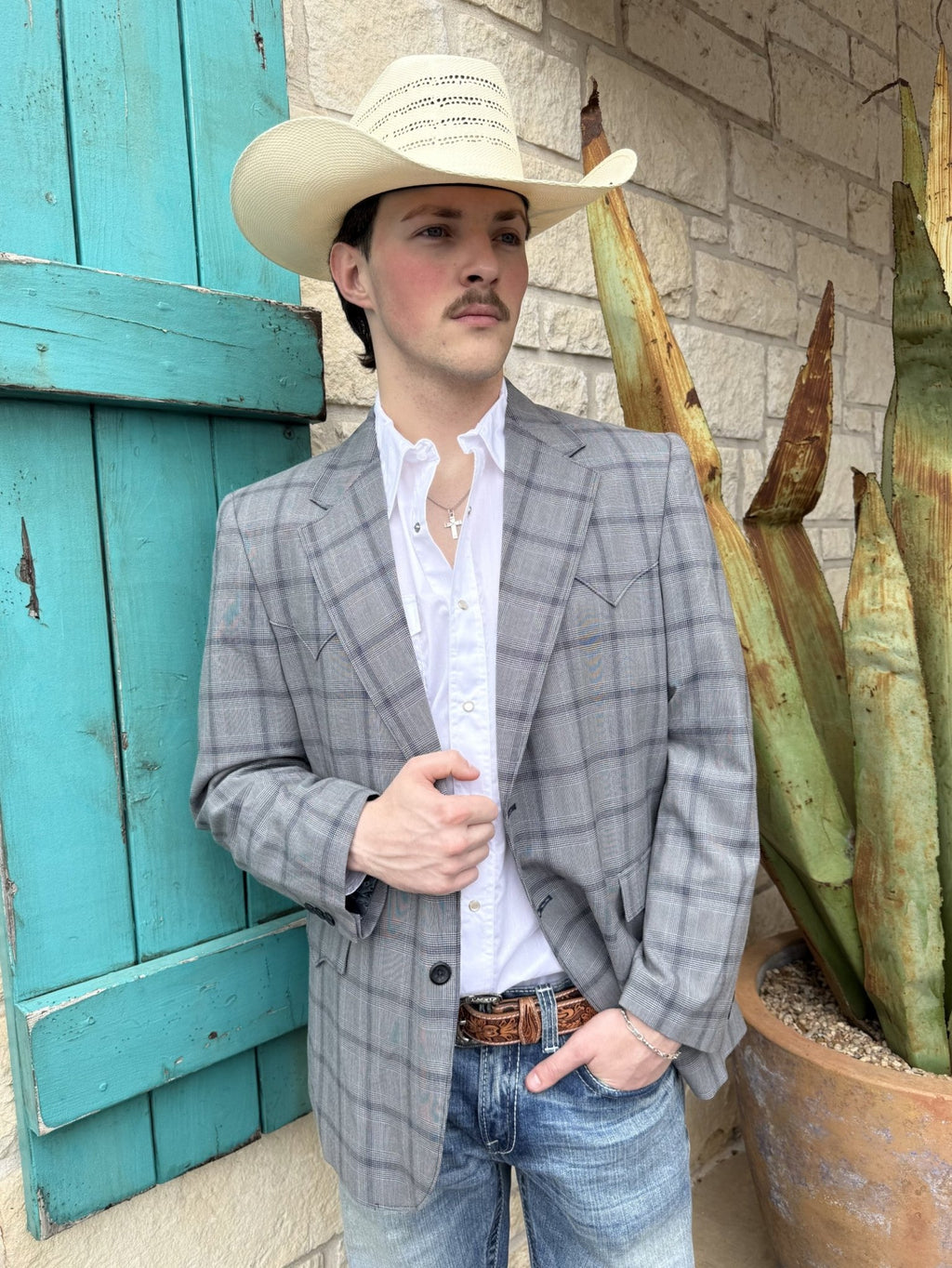 Gray plaid men's western sport coat with structured silhouette, western yokes, and front pocket flaps — Blair's Western Wear Marble Falls TX