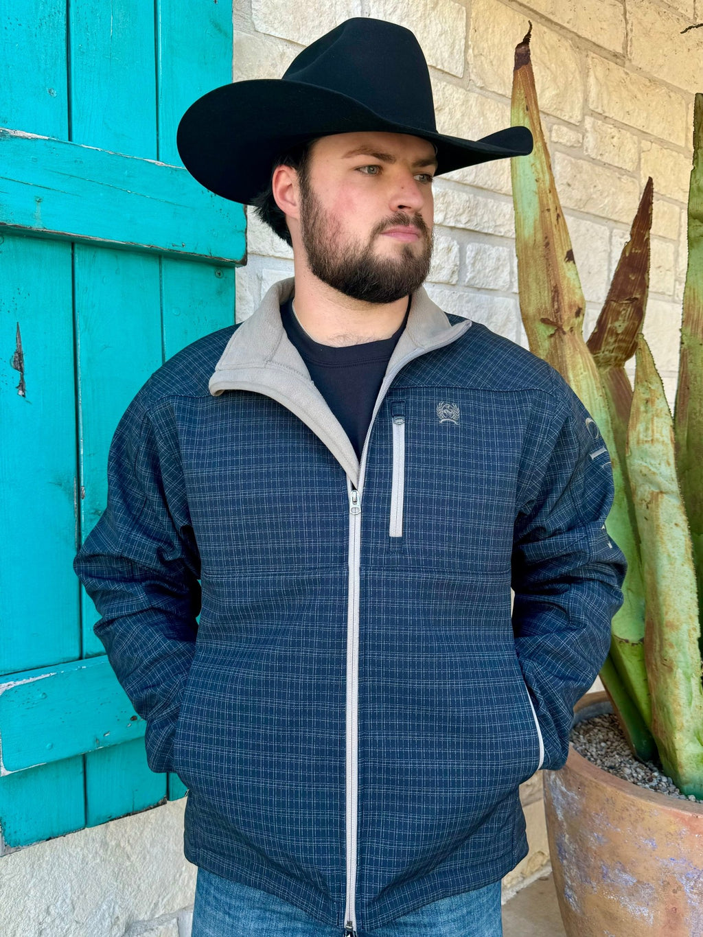 Men's CINCH Bonded Jacket in navy and tan, crafted with poly-spandex and water-resistant finish, featuring zipper closure and exterior pockets - MWJ1583007. Available at Blair's Western Wear, Marble Falls, TX.