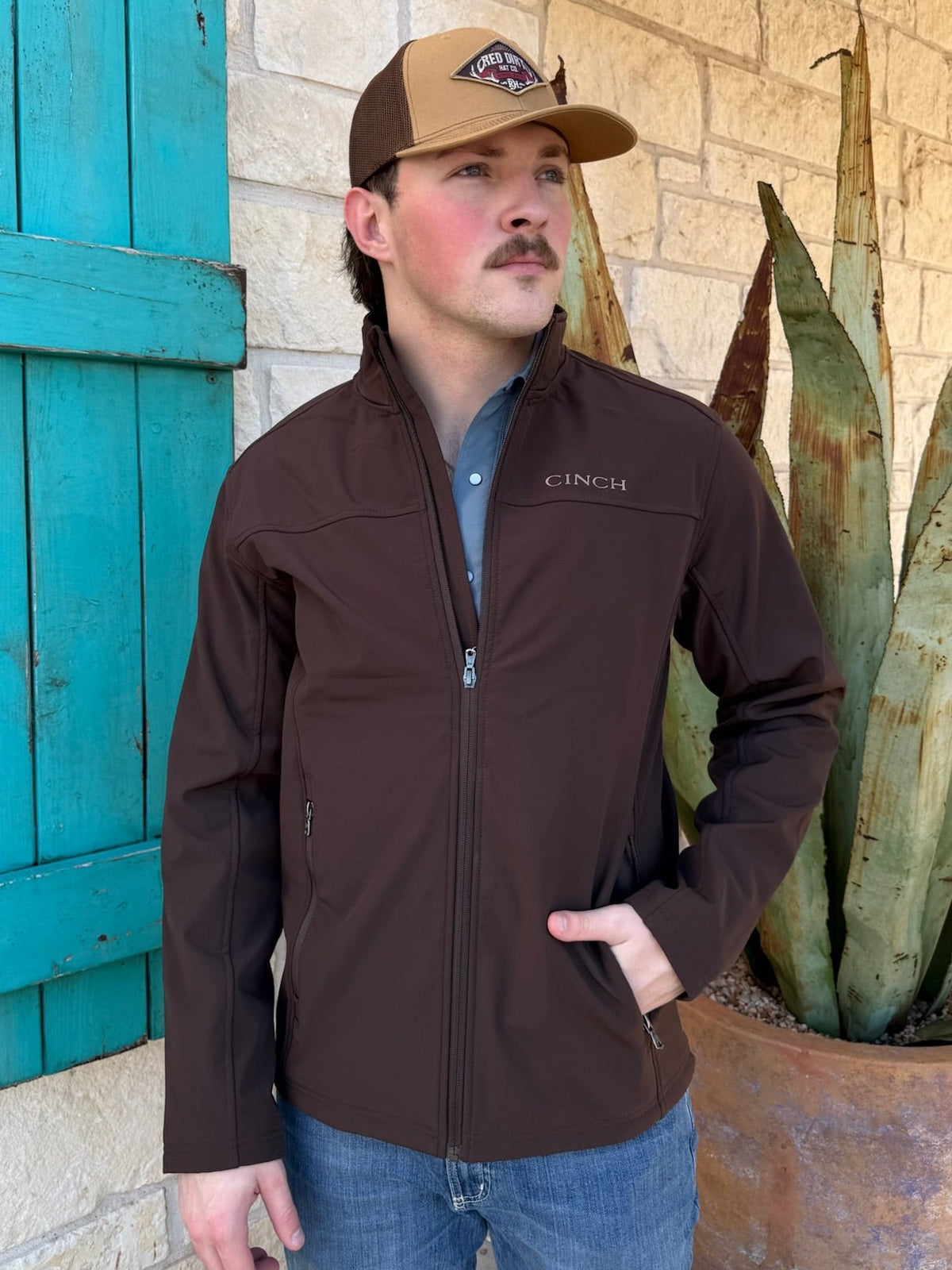 Men’s CINCH softshell windproof jacket in chocolate brown, made with a flexible nylon-spandex shell and micro-waffle fleece lining for lightweight warmth – MWJ1924002. Available at Blair’s Western Wear, Marble Falls, TX.