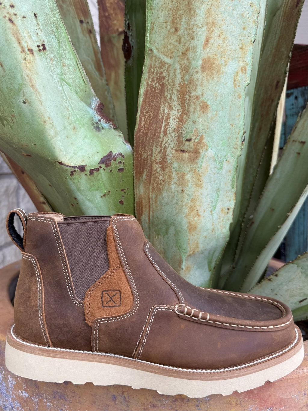 Men's brown full-grain leather slip-on moccasin with elastic side panels, double-stitched seams, rounded moc toe, and rubber outsole — Blair's Western Wear Marble Falls TX⠋