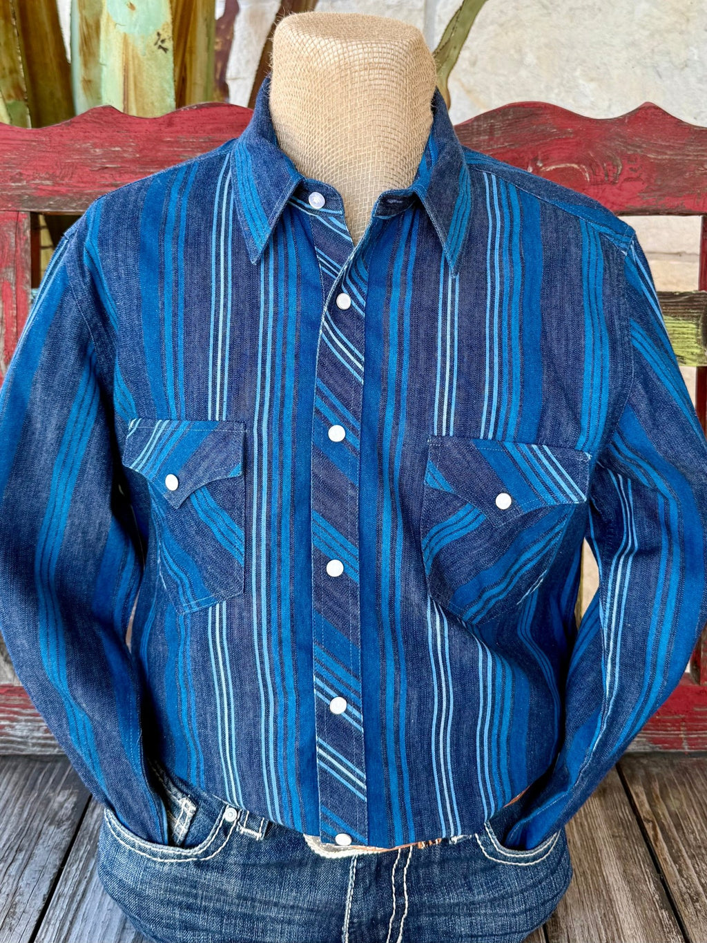 Men’s Panhandle Slim long sleeve Western stripe shirt in navy and blue, built from soft cotton denim for comfort, with pearl snap closures and double chest pockets – BMN2S07153. Available at Blair’s Western Wear, Marble Falls, TX.