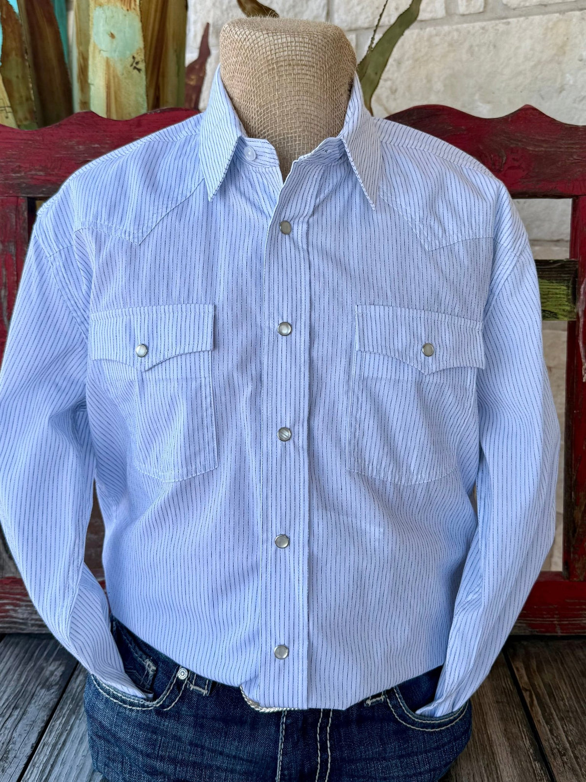 Men’s Panhandle Slim Western shirt in powder blue with fine dash stripes, featuring pearl snap closure and dual flap pockets – RMN2S07083. Available at Blair’s Western Wear, Marble Falls, TX.