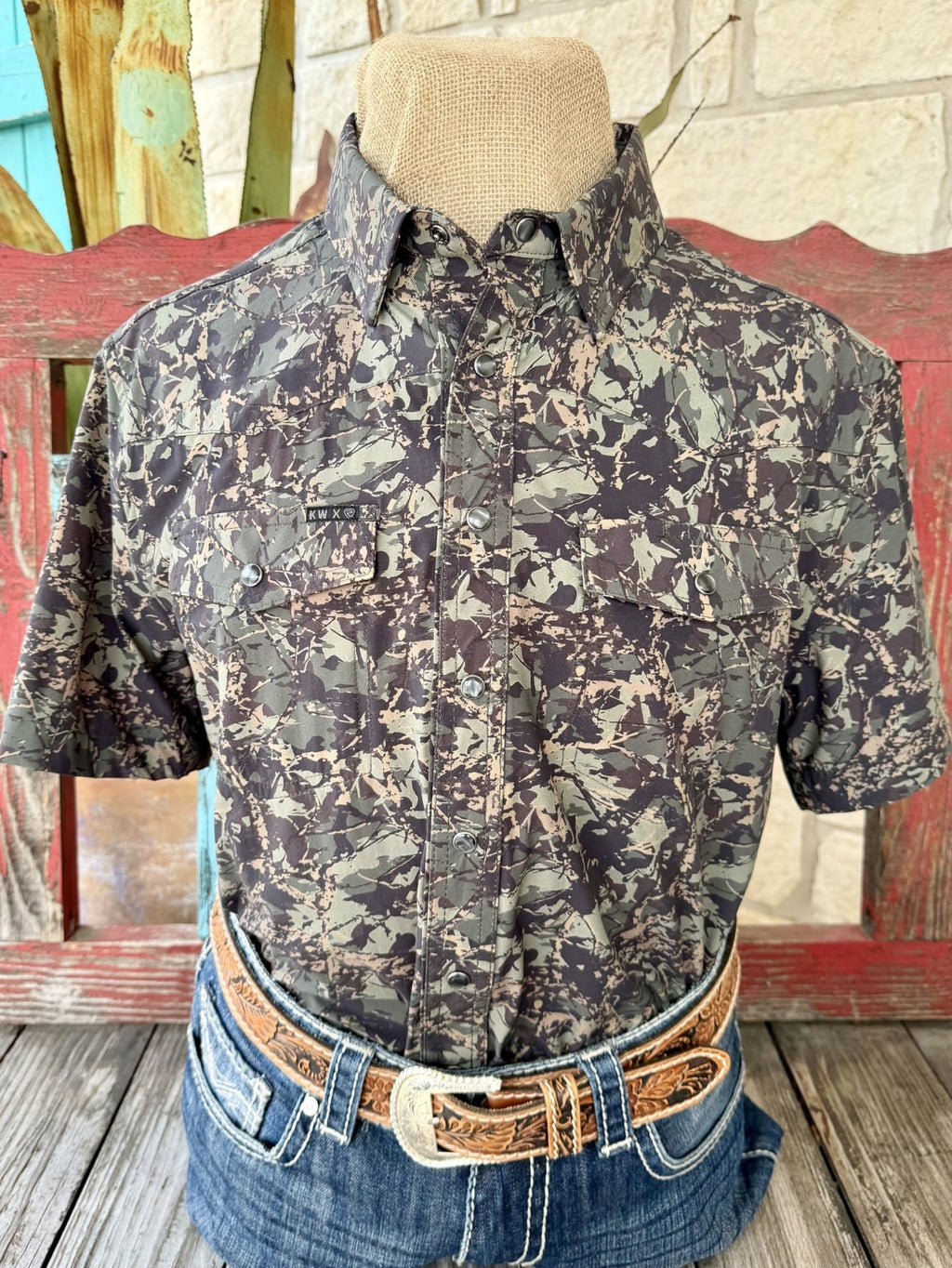 Men's short-sleeve green, tan and dark camouflage shirt with pointed collar, snap-front closure, Western yoke seams and two snap-flap chest pockets — Blair's Western Wear Marble Falls TX