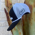 A black and white cap with a white mesh back, black visor, and a white braided trim