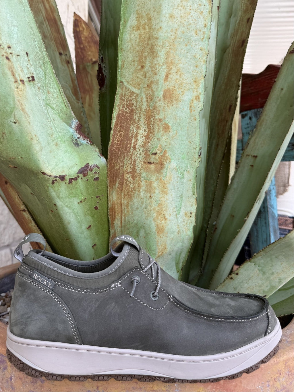 Men's spruce green full-grain leather slip-on shoe with stretch side panels, rear pull tab, rounded moc toe, and textured rubber outsole — Blair's Western Wear Marble Falls TX⠋