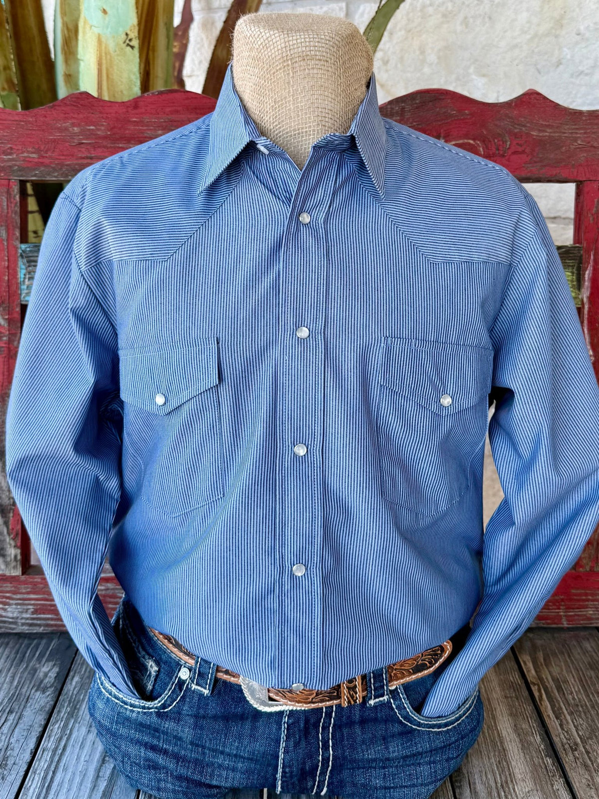 Men’s Roper western shirt in light blue/navy stripe, with snap-front closure and one-point yokes – 1011447015. Available at Blair’s Western Wear, Marble Falls, TX.