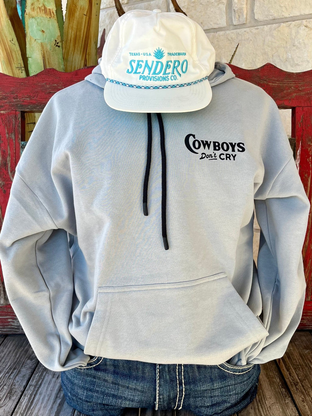 Men's Sendero Hoodie in light blue, featuring 'Cowboys Don't Cry' on the front and a detailed cowboy graphic on the back - CWBY DONT CRY SW. Available at Blair's Western Wear, Marble Falls, TX.