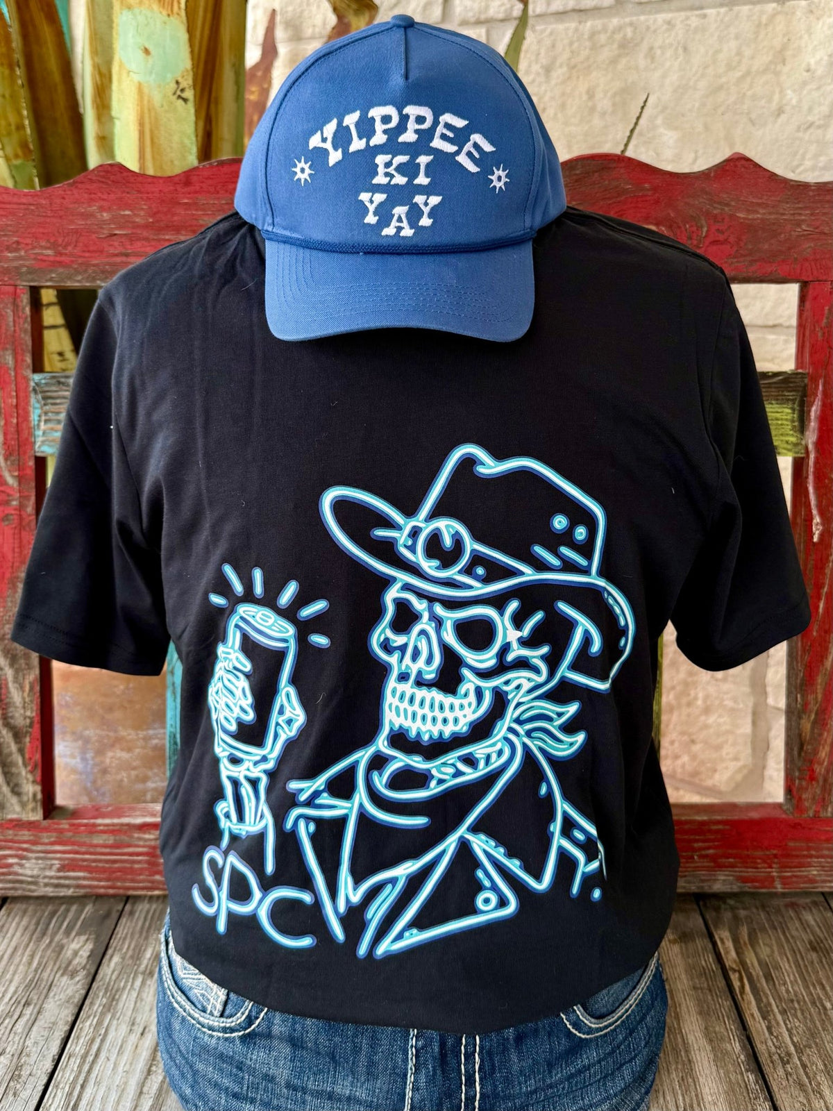 Men’s Sendero short sleeve graphic t-shirt in black with turquoise neon cowboy skull design, soft cotton blend for comfort, and relaxed fit for everyday wear - BRDWY BONES B. Available at Blair's Western Wear, Marble Falls, TX.