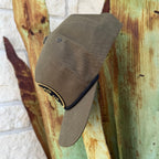 An olive cap with a curved brim and a black rope detail