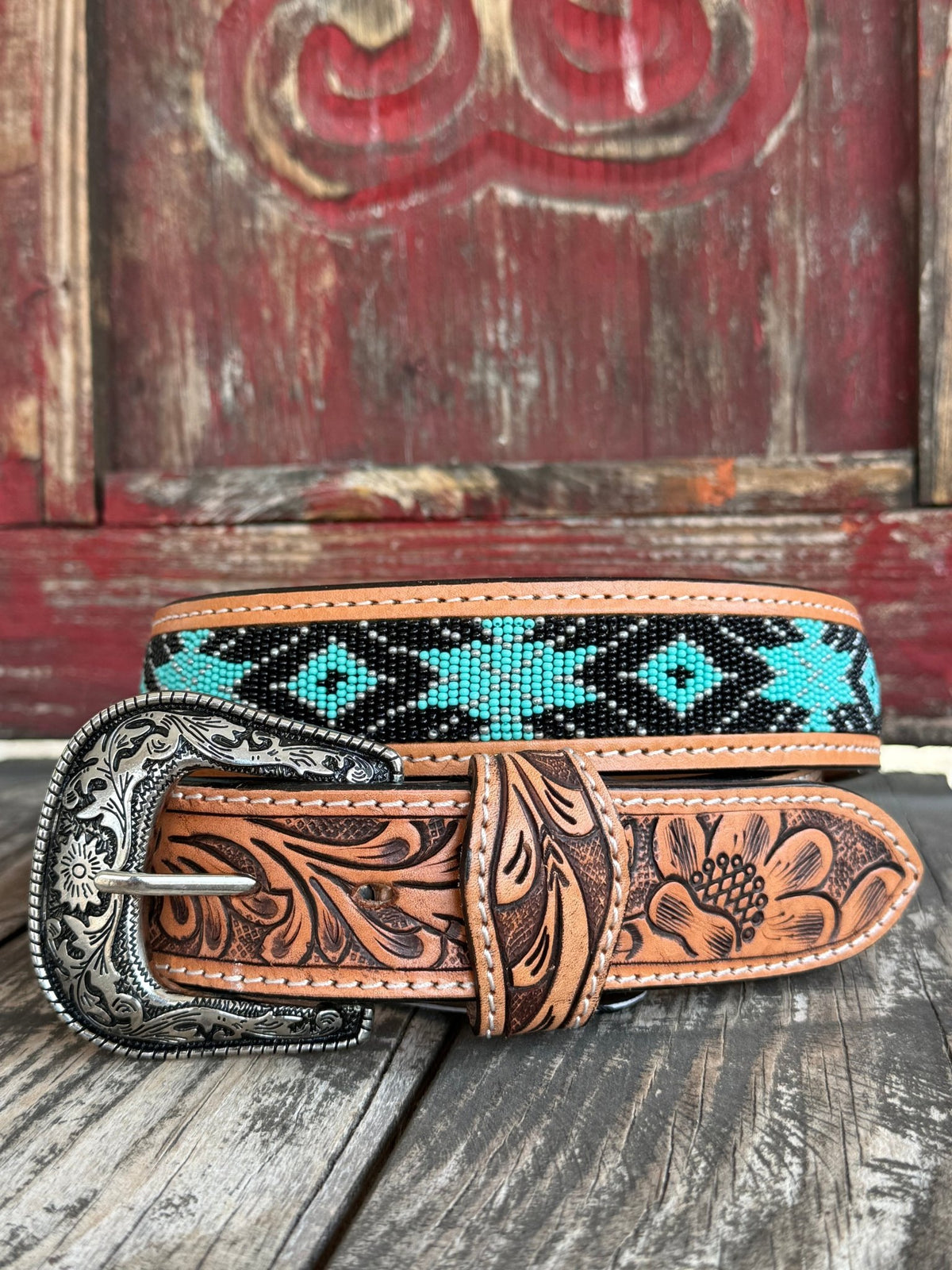 Men’s TACKRUS Western Belt in natural, black, and turquoise, hand-tooled leather with turquoise and black Aztec beaded inlay and antique silver engraved buckle - 26RT38B. Available at Blair's Western Wear, Marble Falls, TX.
