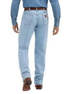 Rear view of a person wearing light-wash blue denim jeans with a brown belt and brown boots, against a plain white studio background.