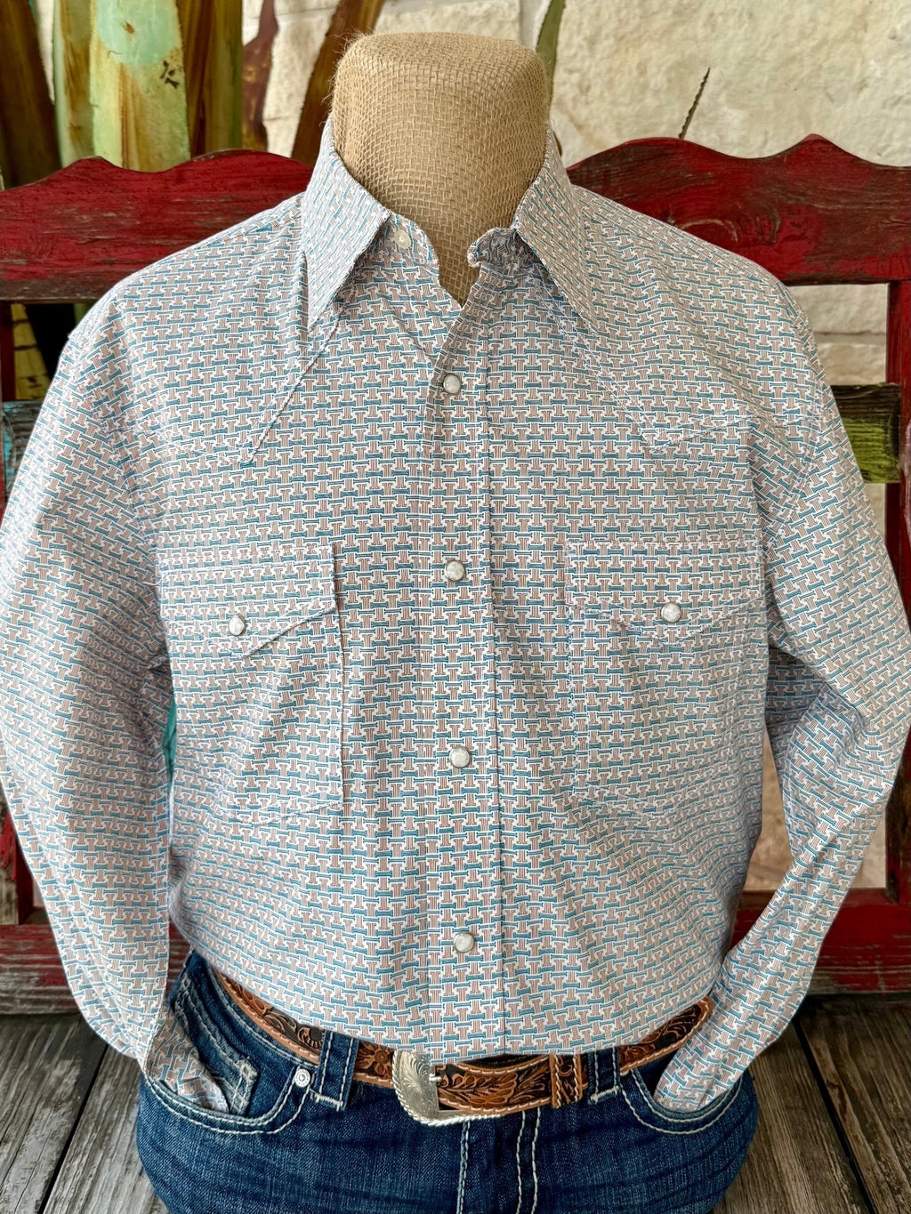 Men’s Wrangler long sleeve snap print shirt in white with teal and brown pattern, breathable cotton blend fabric, with pearl snap closures and dual front snap pockets - 112367939. Available at Blair's Western Wear, Marble Falls, TX.