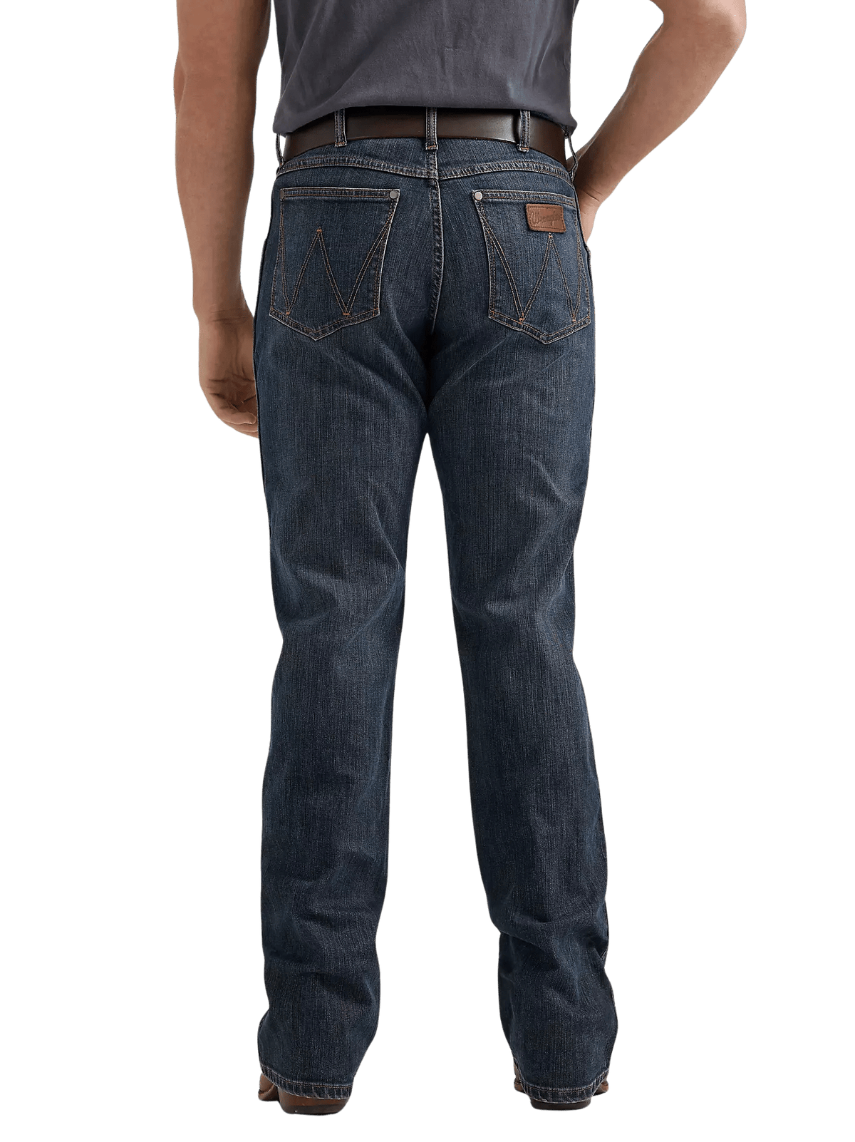 Rear view of a person wearing dark blue denim jeans with a brown leather patch on the back pocket, paired with a dark gray t-shirt and brown belt, against a plain white background.