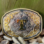 Montana Silversmiths Western Belt Buckle in silver and gold, featuring intricate engravings and a prominent 'T' initial - A1047T. Available at Blair's Western Wear, Marble Falls, TX.