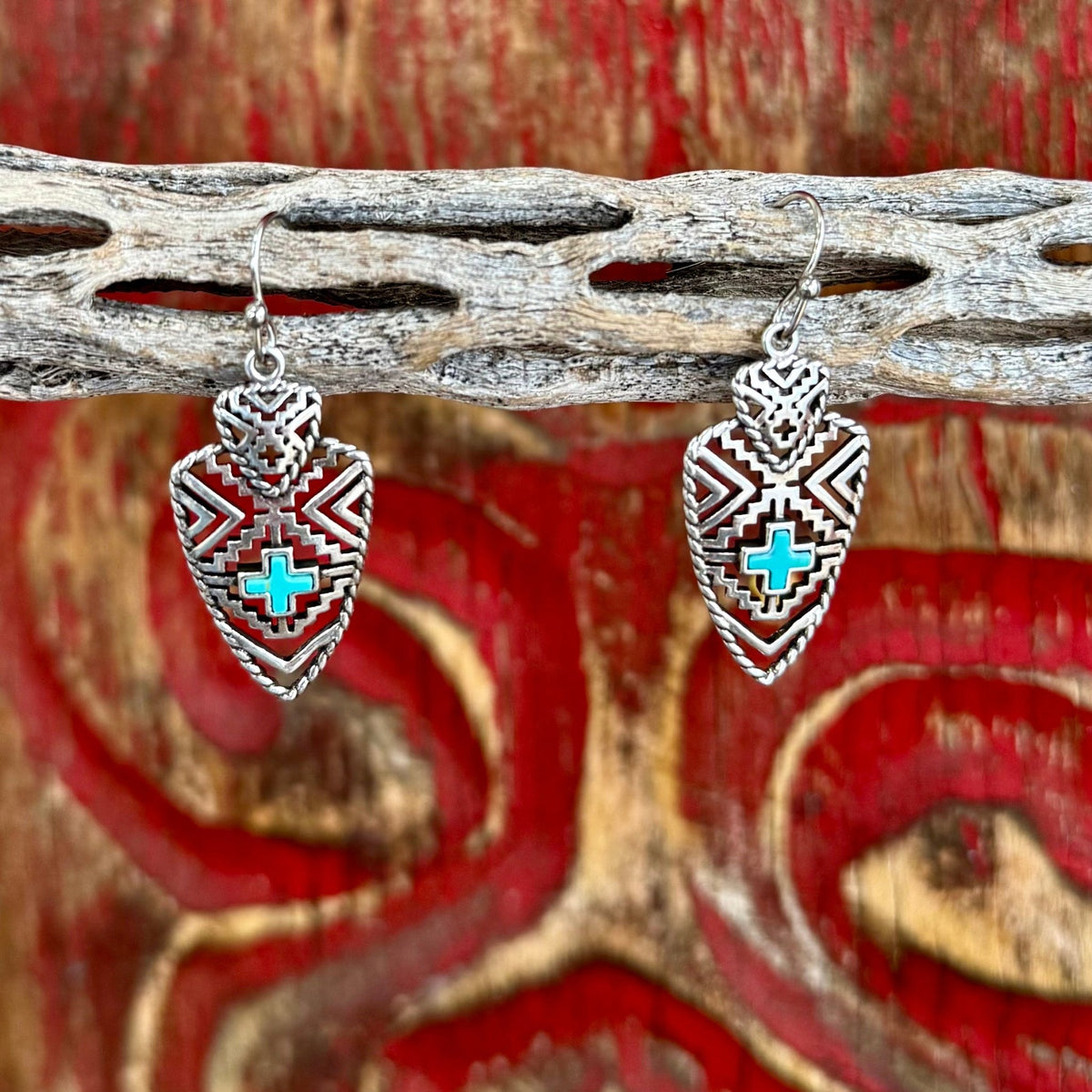 Women’s Montana Silversmiths Southwest silver dangle earrings with turquoise cross inlay, featuring a bold textured pattern and lightweight construction – ER5863. Available at Blair's Western Wear, Marble Falls, TX.
