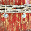 Women’s Montana Silversmiths turquoise thunderbird dangle earrings in silver, crafted with detailed engraving, featuring a central turquoise stone for color contrast, and finished with tarnish-resistant Montana Armor – ER6315. Available at Blair’s Western Wear, Marble Falls, TX.
