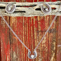 Ladies Montana Silversmiths jewelry set with silver horseshoe necklace and earrings, featuring clear cubic zirconia stones and antique silver finish for elegant western style - JS6307. Available at Blair's Western Wear, Marble Falls, TX.