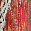 Montana Silversmiths Necklace featuring an intricate silver scroll design in the shape of the letter "R," expertly crafted for durability and lasting shine - NC6096R. Available at Blair's Western Wear, Marble Falls, TX.