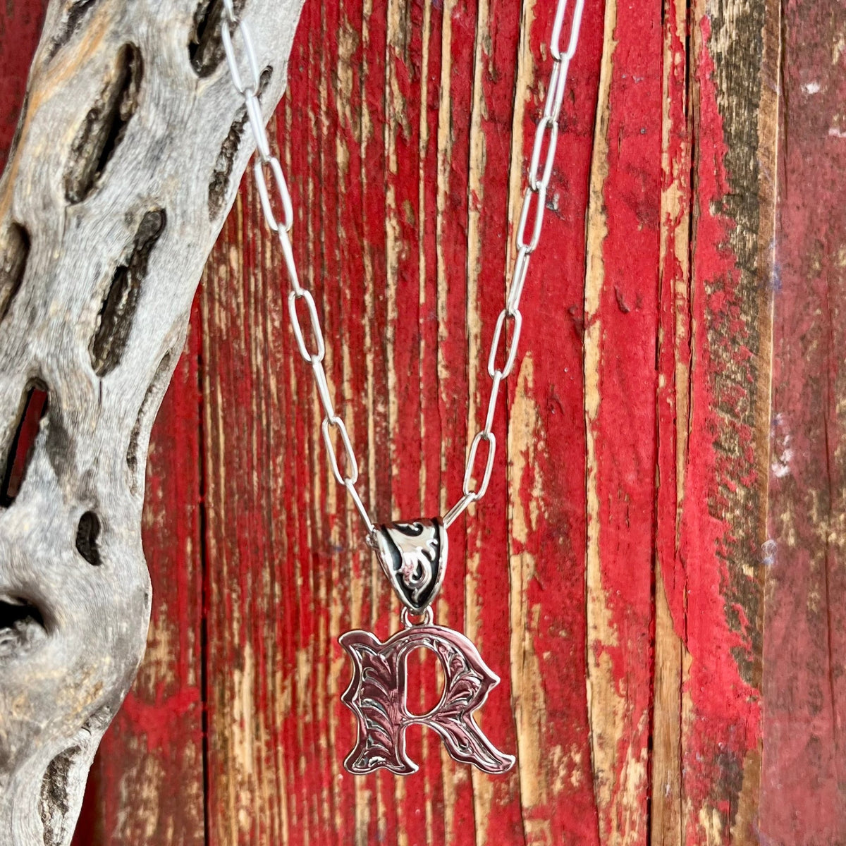 Montana Silversmiths Necklace featuring an intricate silver scroll design in the shape of the letter "R," expertly crafted for durability and lasting shine - NC6096R. Available at Blair's Western Wear, Marble Falls, TX.