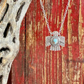 Women’s Montana Silversmiths silver thunderbird necklace with turquoise stone, handcrafted with detailed Western etching, and protected with a tarnish-resistant Montana Armor® finish – NC6315. Available at Blair’s Western Wear, Marble Falls, TX.