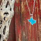 Women’s Montana Silversmiths necklace featuring a Texas-shaped turquoise pendant in silver, crafted with genuine veined turquoise, and set on an adjustable silver chain – NC6322. Available at Blair’s Western Wear, Marble Falls, TX.