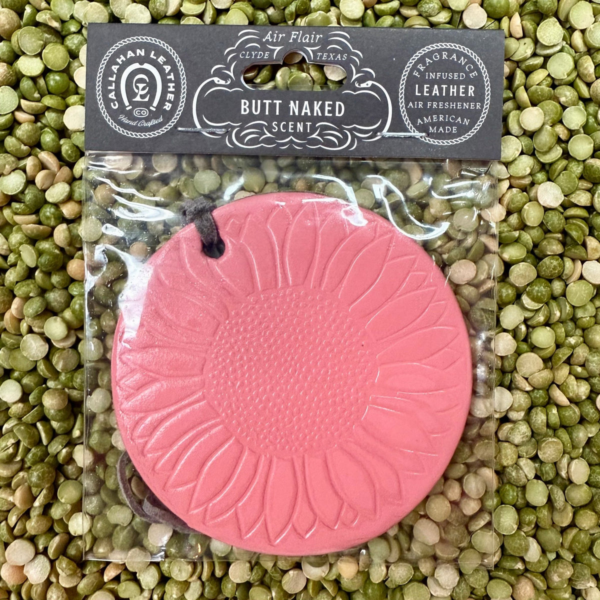 Callahan Leather Sunflower Butt Naked Pink Air Freshener in leather, crafted with a sunflower embossed design, with a tropical fruit and floral Butt Naked scent - AFRSFPNKBC. Available at Blair's Western Wear, Marble Falls, TX.