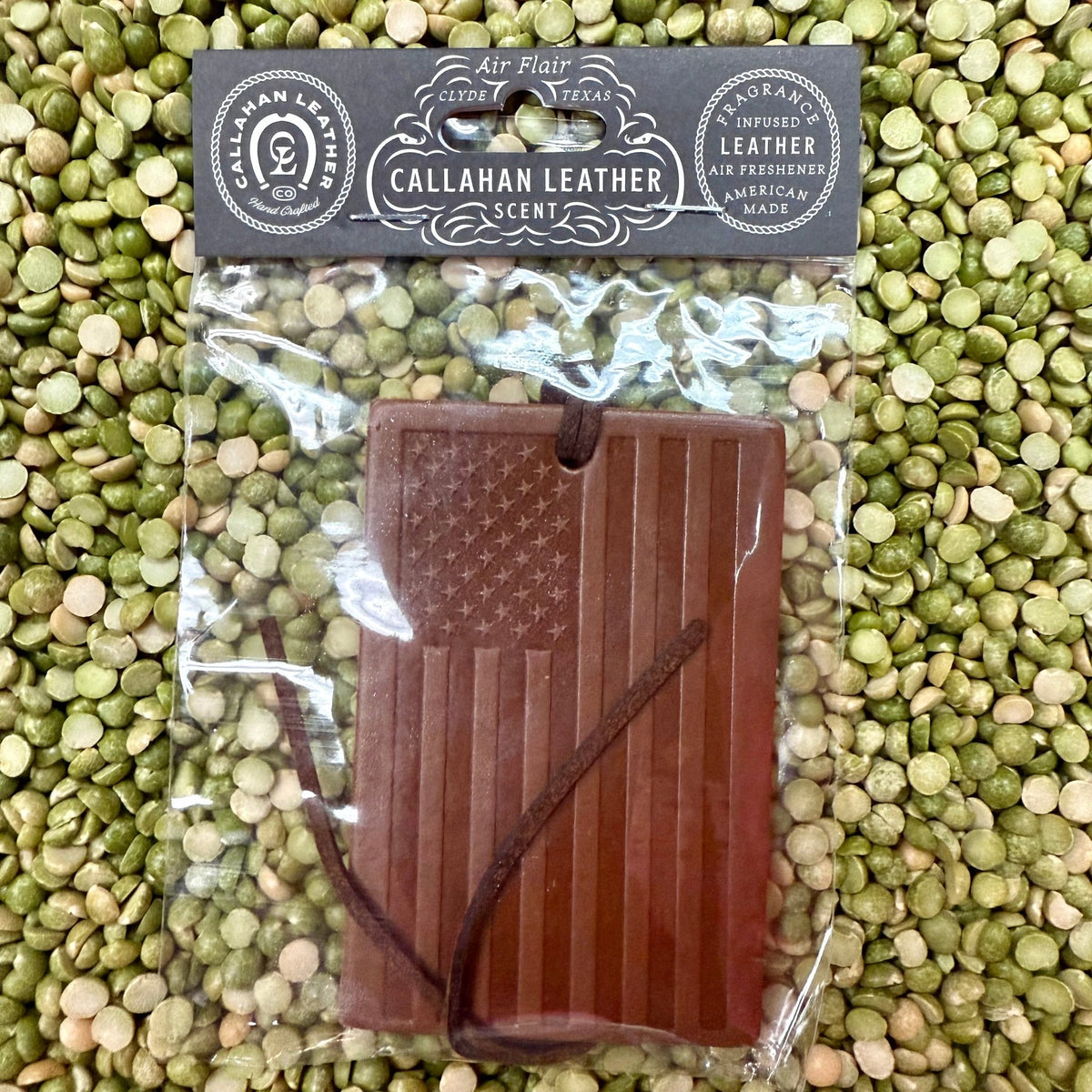 Callahan Leather Old Glory Flag Leather Air Freshener in Brown, crafted with premium leather infusion for a long-lasting fragrance, with embossed American flag design for a patriotic look - AFRECOGLTH. Available at Blair's Western Wear, Marble Falls, TX.