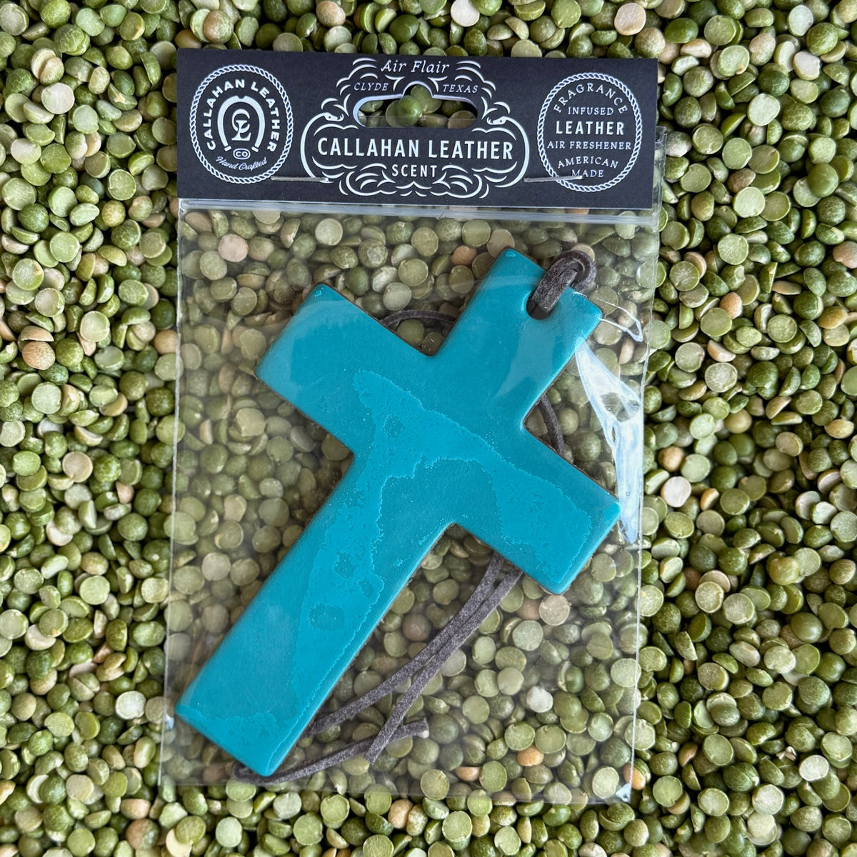 Callahan Leather Air Freshener Cross in Turquoise, handcrafted from full-grain leather, infused with Leather scent, with a leather hanging cord – AFCROSSTRQLTH. Available at Blair's Western Wear, Marble Falls, TX.
