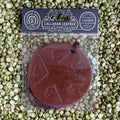 Callahan Leather Air Freshener Texas Star Flag in Brown, crafted from full-grain vegetable-tanned leather, infused with signature leather scent, featuring a round medallion design with embossed Texas star and "TEXAS" lettering, includes hanging cord - AFRVTFBRWLTH. Available at Blair's Western Wear, Marble Falls, TX.