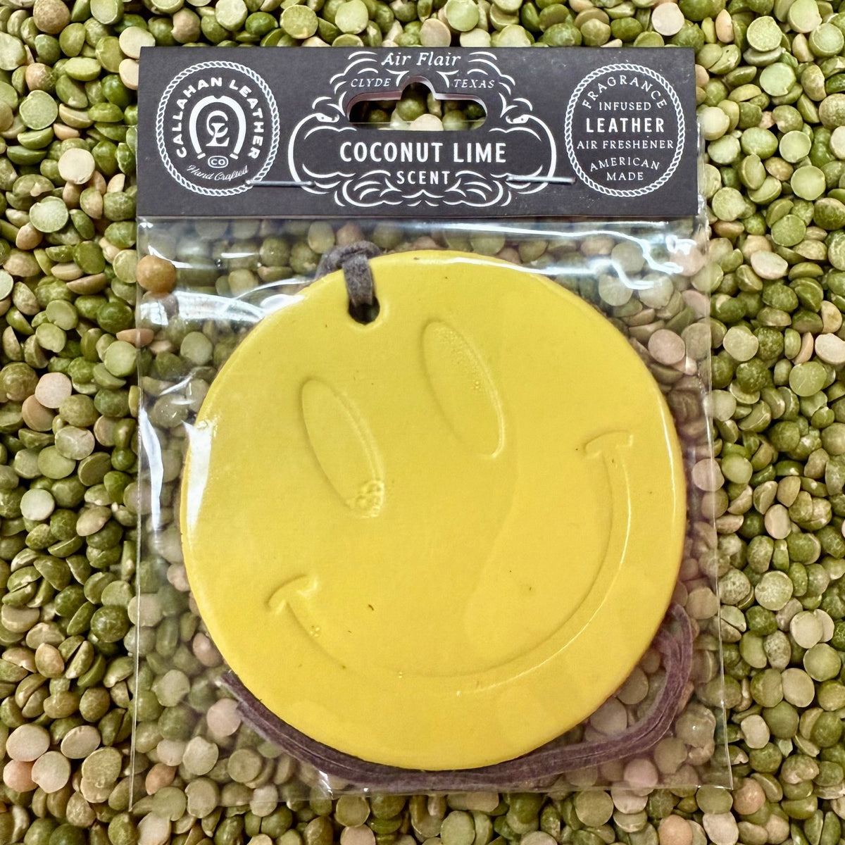 Callahan Leather Round Smile Air Freshener in Yellow, made from genuine leather for long-lasting scent, with refreshing coconut lime fragrance - AFRSMILYLLCL2. Available at Blair's Western Wear, Marble Falls, TX.