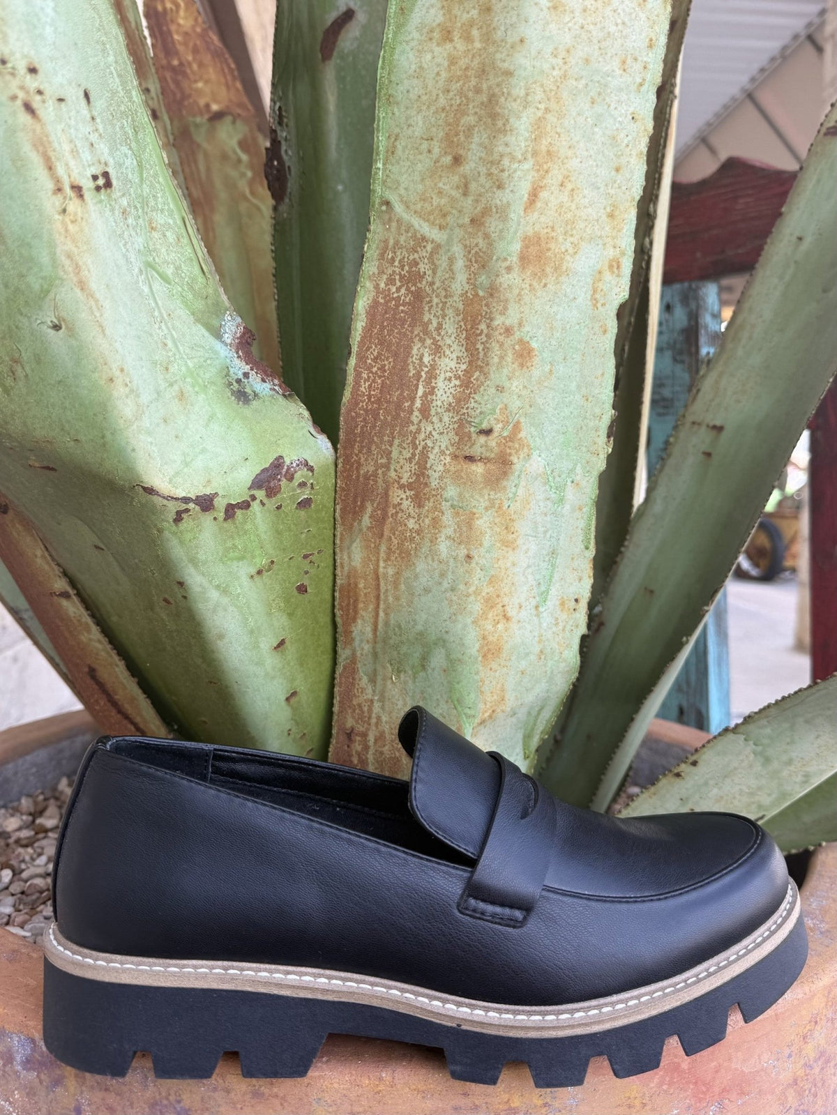 Women's black-and-tan slip-on penny loafer with a chunky sole — Blair's Western Wear Marble Falls TX