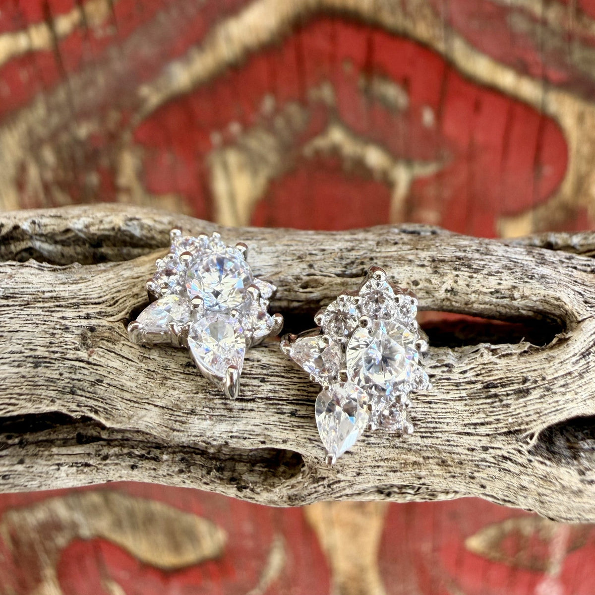 Silver-tone CZ cluster stud earrings with clear round and pear-shaped accents in elongated prong-set arrangements — Blair's Western Wear Marble Falls TX