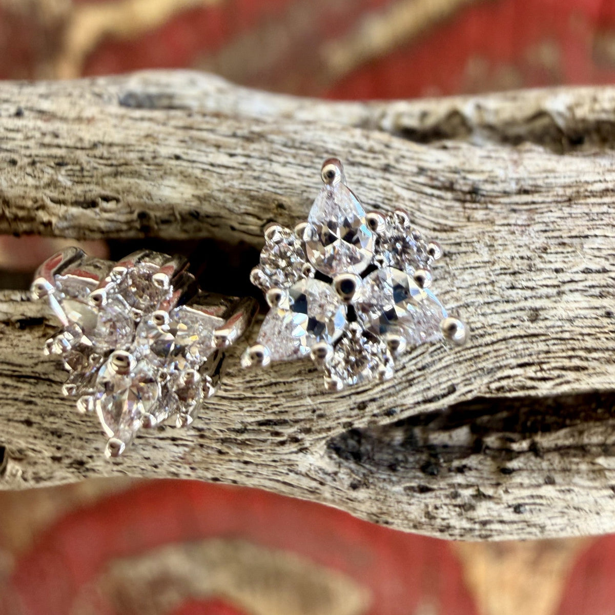 Close-up of silver-tone CZ cluster studs with three pear-shaped clear accents and smaller round details — Blair's Western Wear Marble Falls TX
