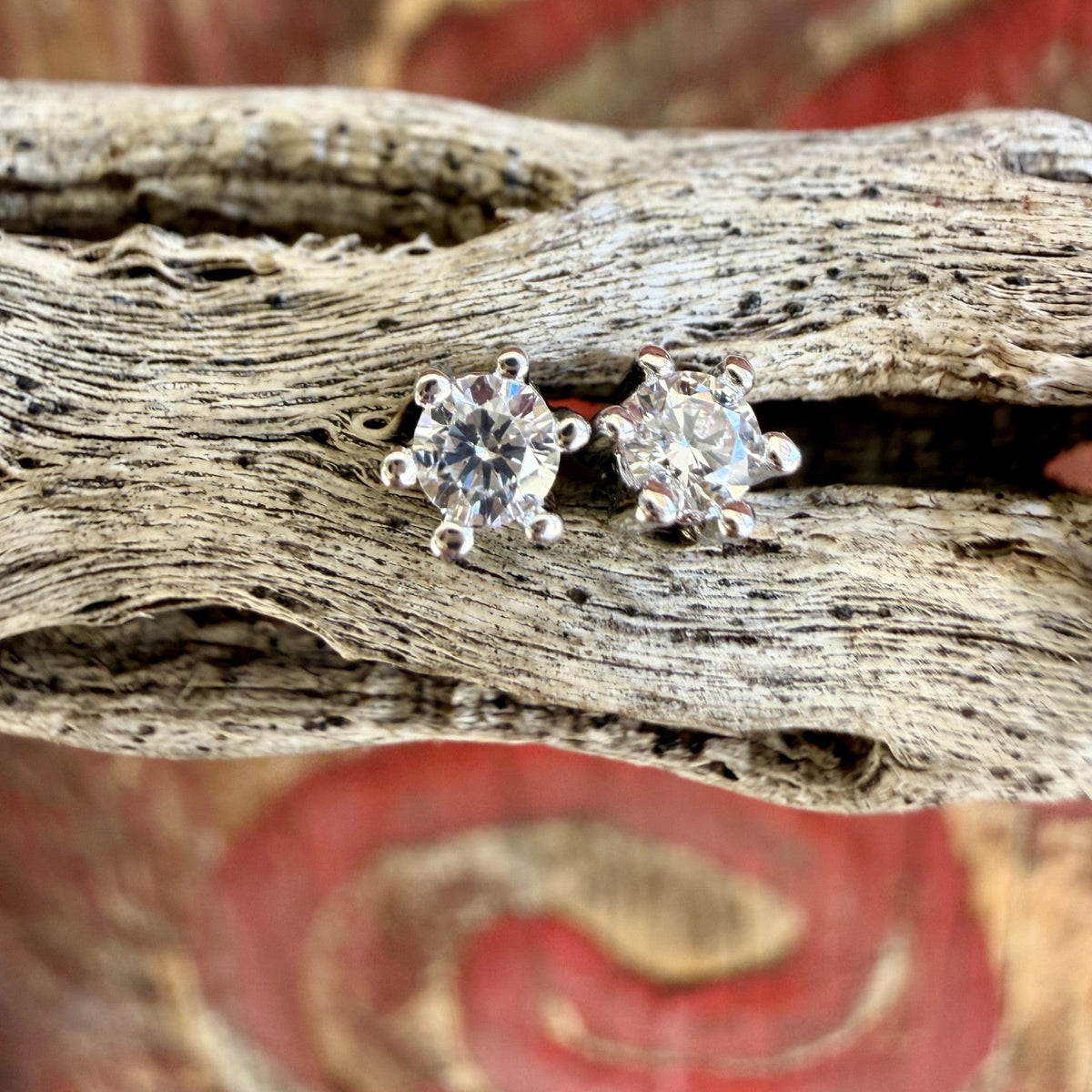 Silver-tone round CZ stud earrings with clear faceted centers and prong settings — Blair's Western Wear Marble Falls TX