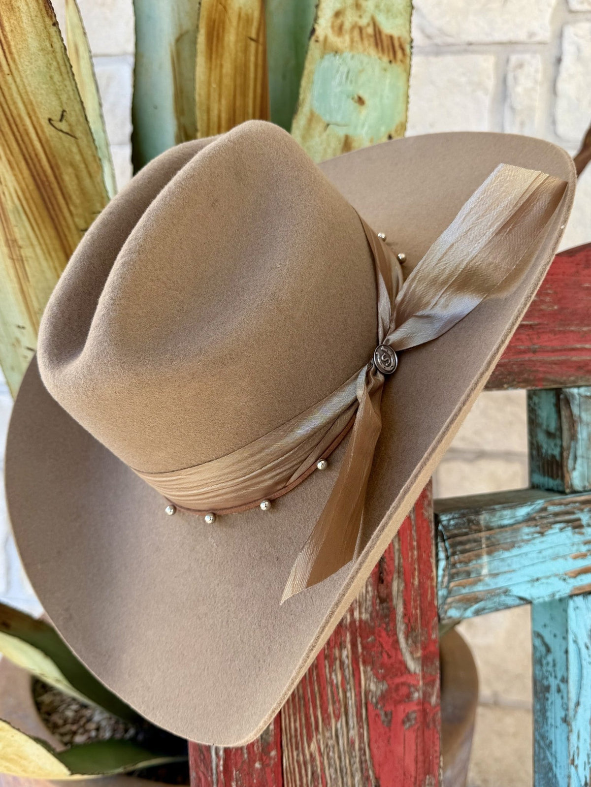 Buck tan felt Western hat with creased crown, layered fabric band, metallic beads and feather detail — Blair's Western Wear Marble Falls TX