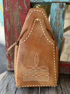 Ladies Sling Bag Tan Leather Sling in rich brown leather, crafted with white whipstitch detailing and a secure zipper pocket - ADBGM605B. Available at Blair's Western Wear, Marble Falls, TX.