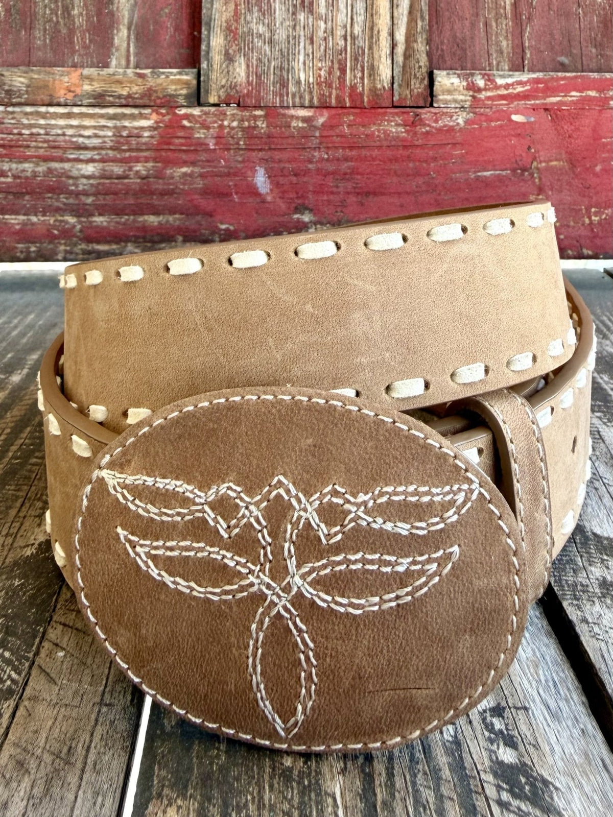 Women's tan Western belt with cream whipstitch edging and oval covered buckle with boot-stitch-inspired embroidery — Blair's Western Wear Marble Falls TX